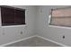 Simple bedroom with grey walls and carpeting at 1650 Pine Ave, Mount Dora, FL 32757