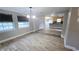 Dining area with kitchen view and wood-look tile floors at 1650 Pine Ave, Mount Dora, FL 32757