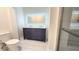 Updated bathroom with double vanity, modern fixtures and a large backlit mirror at 3720 Willis Rd, Mulberry, FL 33860