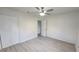 Spacious bedroom with double door closet and wood-look floors at 3720 Willis Rd, Mulberry, FL 33860