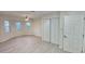 Bright bedroom with large closet and wood-look floors at 3720 Willis Rd, Mulberry, FL 33860