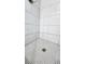 Clean and modern shower with penny round tile floor and subway tile walls at 3720 Willis Rd, Mulberry, FL 33860