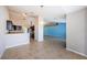 Open kitchen with breakfast bar that flows into a dining area and blue accent wall at 8779 Fort Socrum Village Way, Lakeland, FL 33810