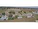 Aerial view highlighting the home's location in a community surrounded by trees and open spaces at 930 Fieldstone Way, Haines City, FL 33844