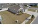 An aerial view of a single-Gathering home with a manicured lawn and an attached two-car garage at 930 Fieldstone Way, Haines City, FL 33844