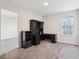 Spacious bedroom with neutral walls and carpet and a large black desk at 930 Fieldstone Way, Haines City, FL 33844