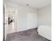 Neutral bedroom with carpet, a closet, and view to another room at 930 Fieldstone Way, Haines City, FL 33844