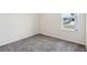 Carpeted bedroom with neutral walls, a window, and great natural light at 930 Fieldstone Way, Haines City, FL 33844