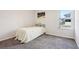 Neutral bedroom with carpet, a bed, and a window showing a view of the neighborhood at 930 Fieldstone Way, Haines City, FL 33844