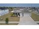 Charming single-Gathering home with a well-manicured lawn, a two-car garage, and a welcoming front entrance at 930 Fieldstone Way, Haines City, FL 33844