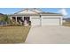 Charming single-story home featuring a well-manicured lawn and a two-car garage at 930 Fieldstone Way, Haines City, FL 33844