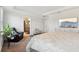 Bright main bedroom with TV, ensuite bathroom, tray ceiling and sleek design at 930 Fieldstone Way, Haines City, FL 33844
