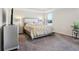 Comfortable main bedroom features neutral walls, a large bed, and two side tables at 930 Fieldstone Way, Haines City, FL 33844