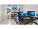 Comfortable office with large wood desk, dual monitors, and relaxing art at 930 Fieldstone Way, Haines City, FL 33844