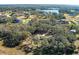 Aerial view showcasing a house and surrounding landscape at 135 Country Club Ln, Mulberry, FL 33860