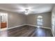 Spacious bedroom with wood-look floors and an arched window at 135 Country Club Ln, Mulberry, FL 33860