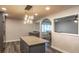 Eat-in kitchen with a large island and pendant lights, open to the dining area at 135 Country Club Ln, Mulberry, FL 33860