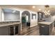 Open kitchen design with wine cooler, granite island, and view into adjacent living area at 135 Country Club Ln, Mulberry, FL 33860