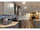 Modern kitchen with gray cabinets, stainless steel appliances, and granite countertops at 135 Country Club Ln, Mulberry, FL 33860