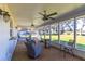 Spacious screened porch overlooking backyard; perfect for relaxing at 135 Country Club Ln, Mulberry, FL 33860