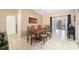 Dining room showcasing a long wooden table with seating for six at 18 Pine Circle Dr, Ocala, FL 34472