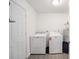 Functional laundry room with modern washer, dryer, and convenient storage space at 18 Pine Circle Dr, Ocala, FL 34472