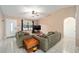 Cozy living room featuring neutral walls, tile flooring, and comfortable sofas facing a television at 18 Pine Circle Dr, Ocala, FL 34472