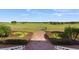 Brick pathway leads to a scenic golf course view at 4827 Waltham Forest Dr, Davenport, FL 33837