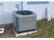 Grey AC unit in the backyard at 4534 Lemans Dr, Orlando, FL 32808