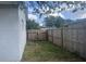 Side yard with wooden fence and gate at 4534 Lemans Dr, Orlando, FL 32808