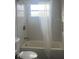 Bathroom with a shower/tub combo and white tile at 4534 Lemans Dr, Orlando, FL 32808