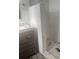 Bathroom with a walk-in shower and gray vanity at 4534 Lemans Dr, Orlando, FL 32808