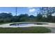 Kidney-shaped pool in backyard at 4534 Lemans Dr, Orlando, FL 32808