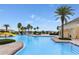 Community pool with a slide and a large deck at 5327 Dagenham Dr, Davenport, FL 33837