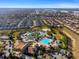 Picturesque aerial view of the community pool, landscaping, homes and neighborhood at 760 Pebble Beach Dr, Davenport, FL 33896