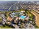 Stunning aerial view of a community pool, cabanas, landscaping and surrounding homes at 760 Pebble Beach Dr, Davenport, FL 33896