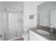 Clean, well-lit bathroom features a glass-enclosed shower and modern fixtures at 760 Pebble Beach Dr, Davenport, FL 33896