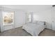 Well-lit bedroom with neutral tones and two windows at 760 Pebble Beach Dr, Davenport, FL 33896