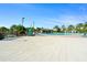 A view of the community pool with a paved patio and landscaping at 760 Pebble Beach Dr, Davenport, FL 33896