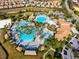 Bird's eye view of all the community amenities: multiple pools, clubhouses, and lazy river for all to enjoy at 760 Pebble Beach Dr, Davenport, FL 33896