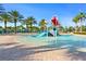 Community splash pad with a small water slide for Gathering fun in the sun at 760 Pebble Beach Dr, Davenport, FL 33896