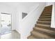 Carpeted staircase leading to the upper level of the home at 760 Pebble Beach Dr, Davenport, FL 33896