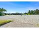 A view of the community sand volleyball court on a sunny day at 760 Pebble Beach Dr, Davenport, FL 33896