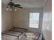 Bedroom with ceiling fan and window at 1106 Avenue N, Haines City, FL 33844