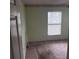 Empty bedroom with light-green walls and carpet at 1106 Avenue N, Haines City, FL 33844