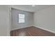 Bright bedroom with wood-look floors and window blinds at 854 4Th St, Winter Haven, FL 33881