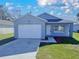 Charming single-story home with a well-maintained lawn, attached garage, and a beautifully painted exterior at 854 4Th St, Winter Haven, FL 33881