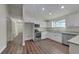 Modern kitchen with white cabinets, granite countertops, and stainless steel appliances at 854 4Th St, Winter Haven, FL 33881