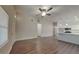 Open living room with hardwood floors and kitchen at 854 4Th St, Winter Haven, FL 33881