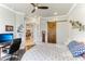 View of bedroom featuring hardwood floors, ceiling fan, and view into dining area at 4079 Grandefield Cir, Mulberry, FL 33860